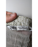 La garantie Once Again : 565609 vêtements d'occasion de marque en état irréprochable.