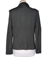 La garantie Once Again : 565815 vêtements d'occasion de marque en état irréprochable.