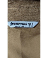 La garantie Once Again : 565996 vêtements d'occasion de marque en état irréprochable.