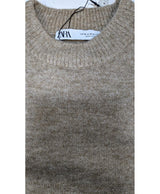 La garantie Once Again : 567122 vêtements d'occasion de marque en état irréprochable.