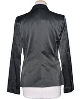La garantie Once Again : 567143 vêtements d'occasion de marque en état irréprochable.