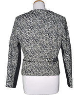 La garantie Once Again : 567240 vêtements d'occasion de marque en état irréprochable.