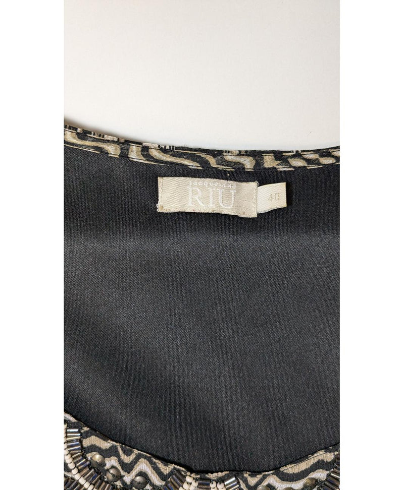 Expérience d'achat simple et satisfaisante pour cette fripe 568340 de qualité, offert par Once Again.