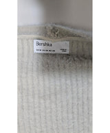 La garantie Once Again : 568418 vêtements d'occasion de marque en état irréprochable.