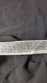 La garantie Once Again : 568540 vêtements d'occasion de marque en état irréprochable.
