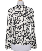 La garantie Once Again : 569603 vêtements d'occasion de marque en état irréprochable.