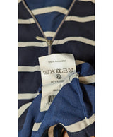 La garantie Once Again : 570350 vêtements d'occasion de marque en état irréprochable.