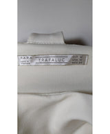 La garantie Once Again : 570435 vêtements d'occasion de marque en état irréprochable.
