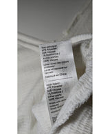 La garantie Once Again : 571292 vêtements d'occasion de marque en état irréprochable.