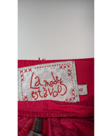 La garantie Once Again : 571528 vêtements d'occasion de marque en état irréprochable.