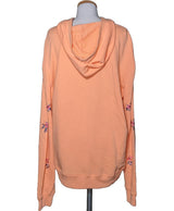 La garantie Once Again : 571617 vêtements d'occasion de marque en état irréprochable.