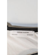 La garantie Once Again : 571723 vêtements d'occasion de marque en état irréprochable.
