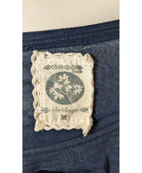 La garantie Once Again : 571757 vêtements d'occasion de marque en état irréprochable.