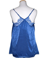 La garantie Once Again : 572583 vêtements d'occasion de marque en état irréprochable.