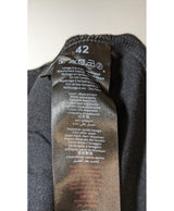 La garantie Once Again : 572585 vêtements d'occasion de marque en état irréprochable.
