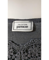 La garantie Once Again : 573242 vêtements d'occasion de marque en état irréprochable.