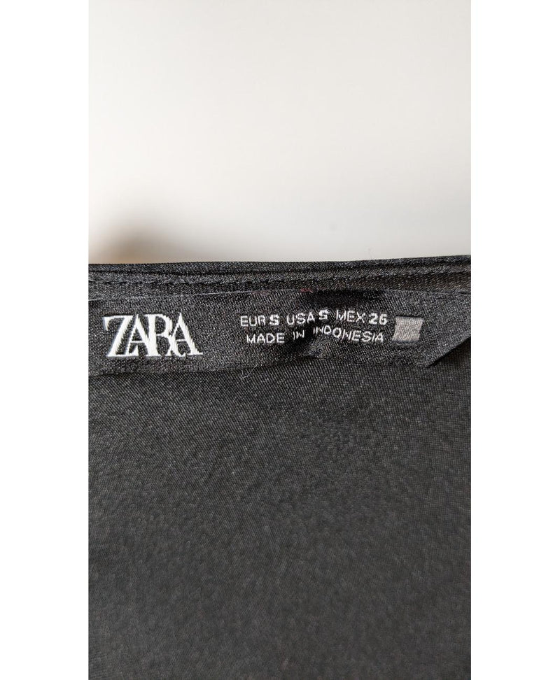 La garantie Once Again : 573701 vêtements d'occasion de marque en état irréprochable.