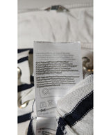 La garantie Once Again : 573808 vêtements d'occasion de marque en état irréprochable.