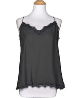 La garantie Once Again : 573900 vêtements d'occasion de marque en état irréprochable.