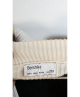 La garantie Once Again : 574323 vêtements d'occasion de marque en état irréprochable.