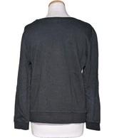 La garantie Once Again : 574541 vêtements d'occasion de marque en état irréprochable.