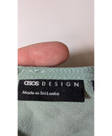 La garantie Once Again : 575567 vêtements d'occasion de marque en état irréprochable.