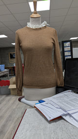 La garantie Once Again : 575617 vêtements d'occasion de marque en état irréprochable.