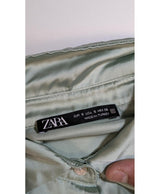 La garantie Once Again : 576324 vêtements d'occasion de marque en état irréprochable.