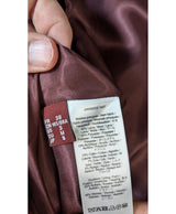 La garantie Once Again : 577680 vêtements d'occasion de marque en état irréprochable.