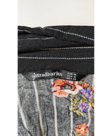 La garantie Once Again : 578544 vêtements d'occasion de marque en état irréprochable.