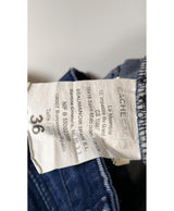 La garantie Once Again : 578612 vêtements d'occasion de marque en état irréprochable.