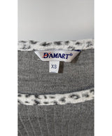 La garantie Once Again : 578627 vêtements d'occasion de marque en état irréprochable.