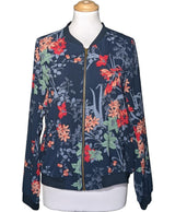 La garantie Once Again : 579043 vêtements d'occasion de marque en état irréprochable.