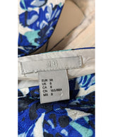 La garantie Once Again : 579238 vêtements d'occasion de marque en état irréprochable.