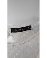 La garantie Once Again : 579933 vêtements d'occasion de marque en état irréprochable.