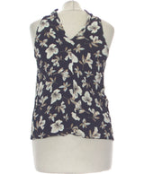 427129 Tops et t-shirts MANGO Occasion Vêtement occasion seconde main